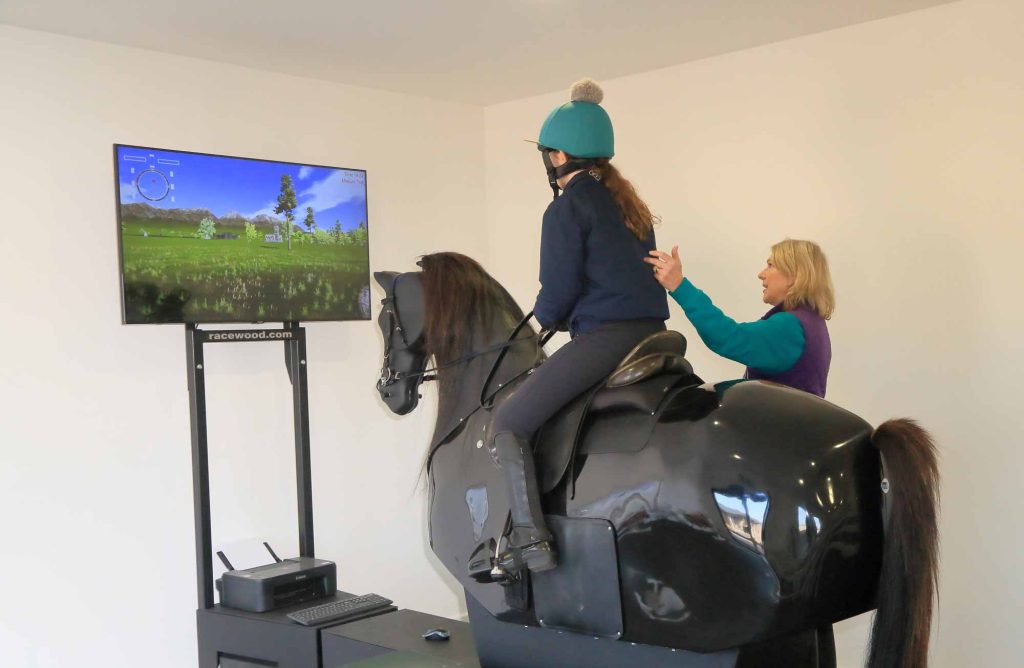 A rider practicing on the mechanical horse